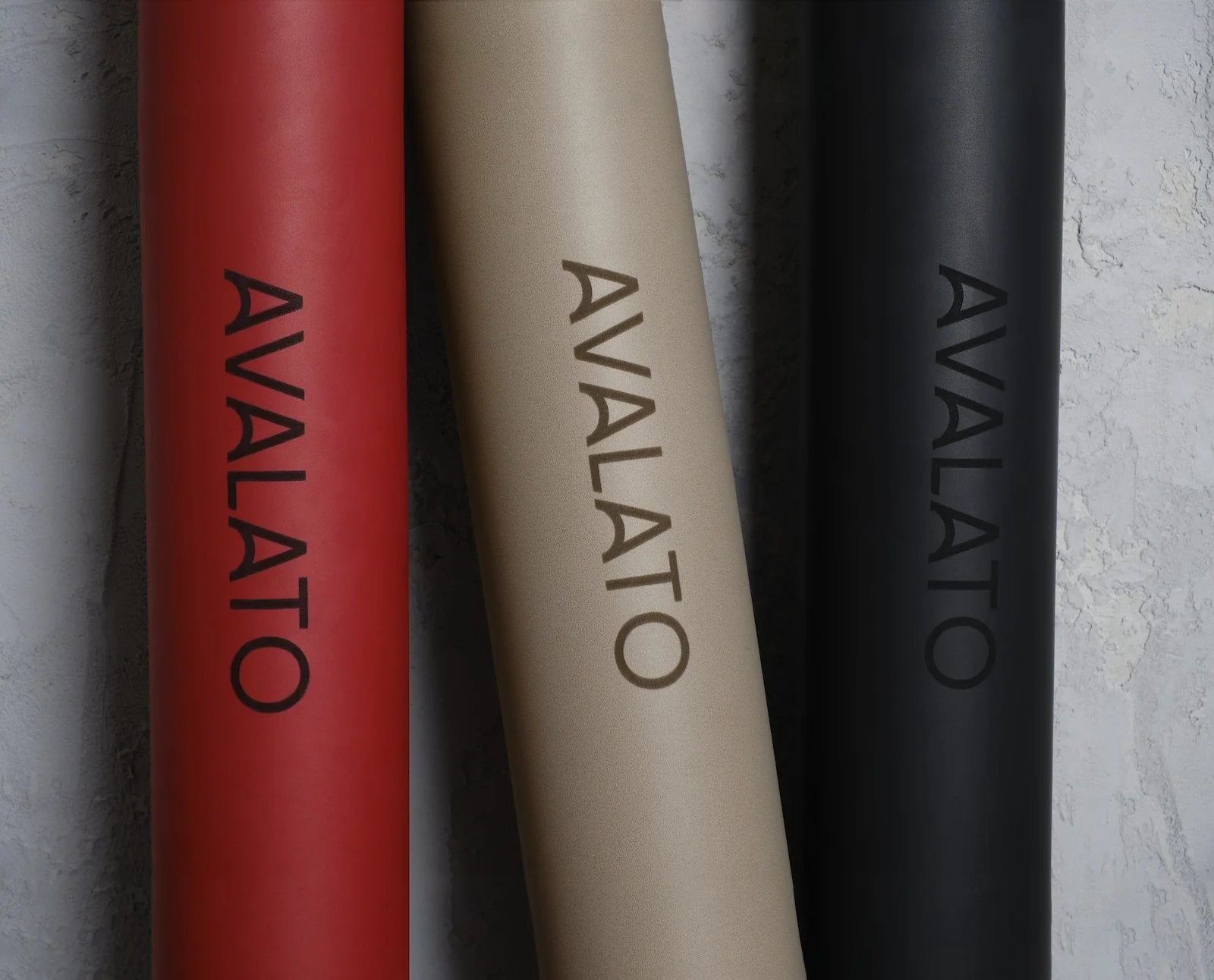 Close-up of AVALATO red, beige, and black exercise mats showcasing high quality leather