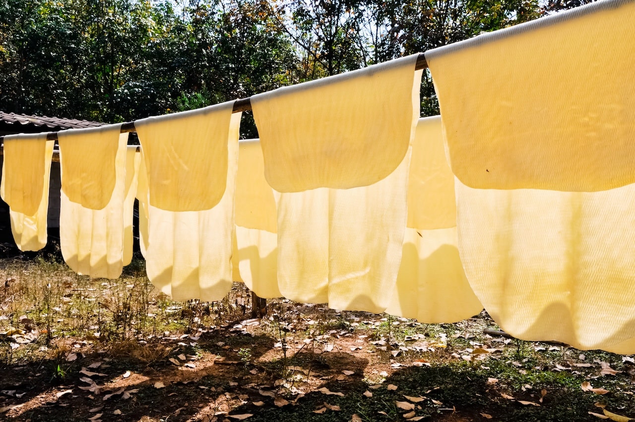 eco friendly natural rubber sheets drying out on the nature made from latex