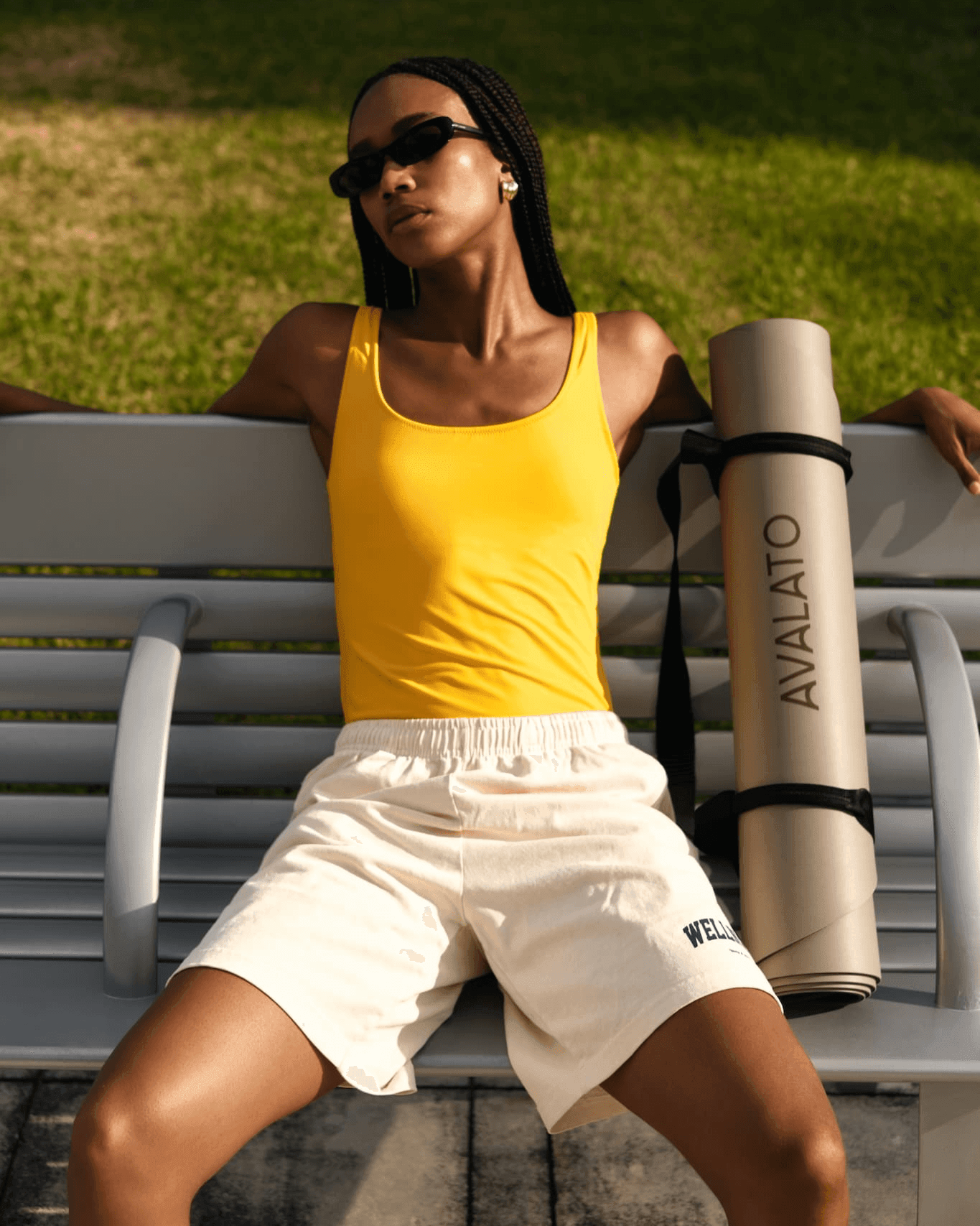 sporty-woman-relaxing-bench-yoga-mat - AVALATO 